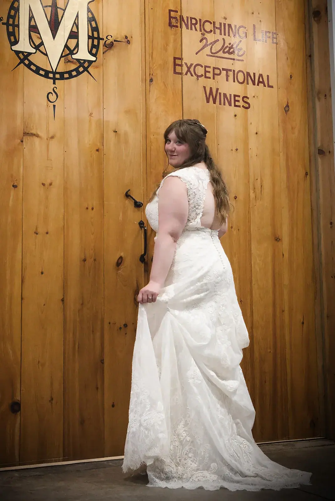 Bride winery doors portrait — Kayla & Robert's wedding at Mackinaw Trail Winery, Petoskey