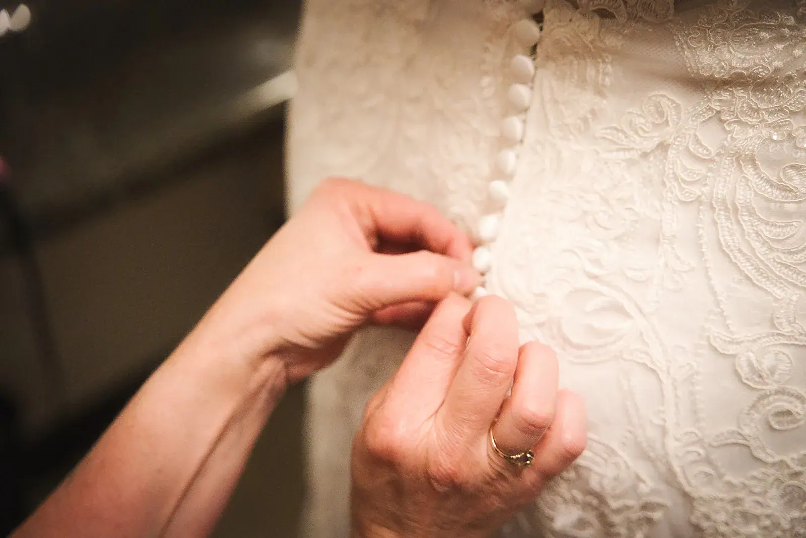 Dress buttons detail — Kayla & Robert's wedding at Mackinaw Trail Winery, Petoskey