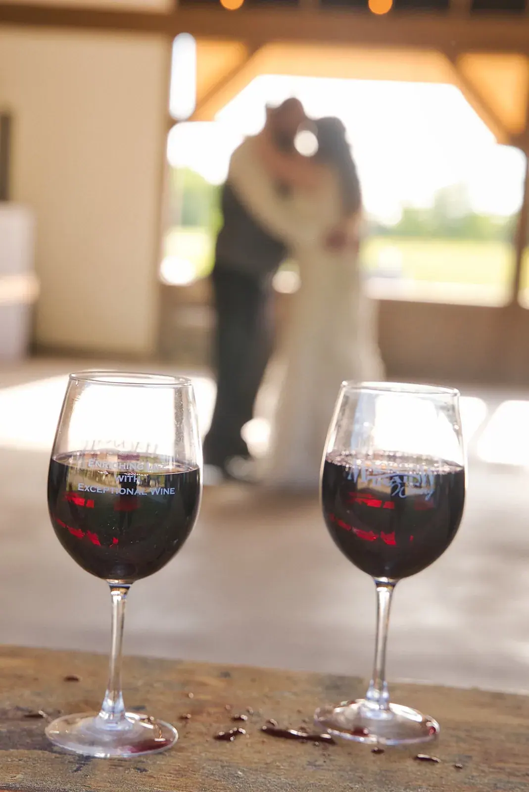 First dance wine glasses — Kayla & Robert's wedding at Mackinaw Trail Winery, Petoskey