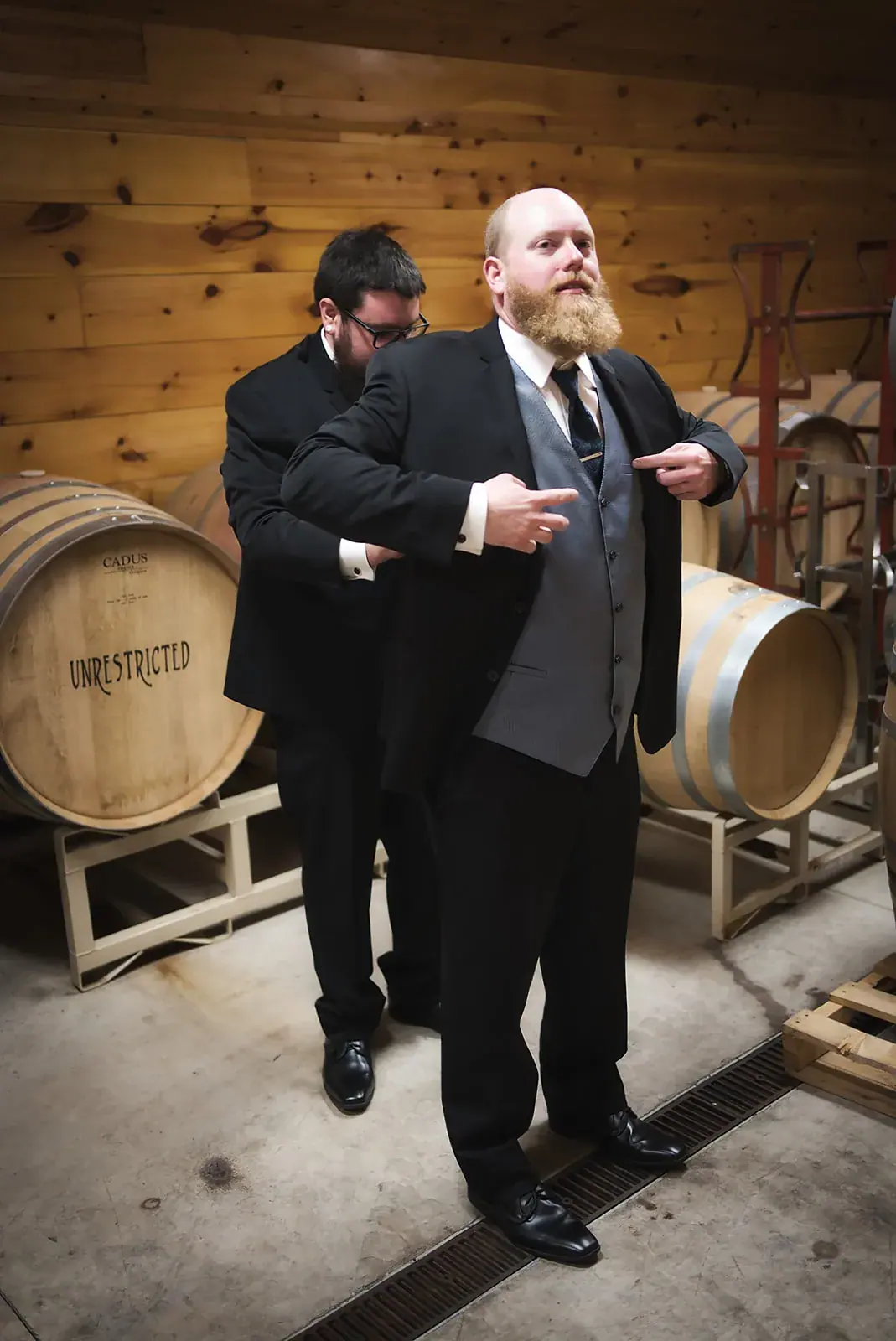 Groom best man barrel room — Kayla & Robert's wedding at Mackinaw Trail Winery, Petoskey