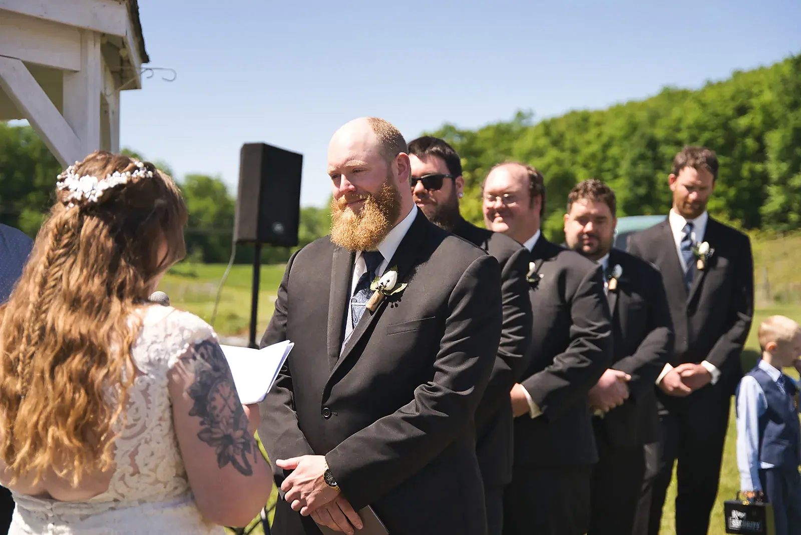 Groom groomsmen ceremony — Kayla & Robert's wedding at Mackinaw Trail Winery, Petoskey