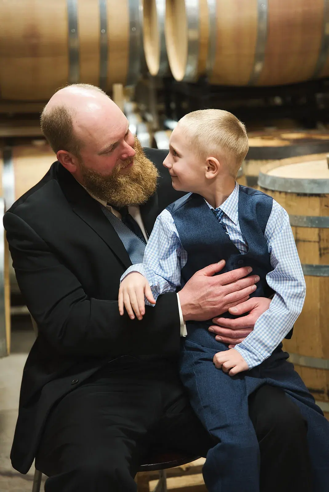 Groom son candid — Kayla & Robert's wedding at Mackinaw Trail Winery, Petoskey