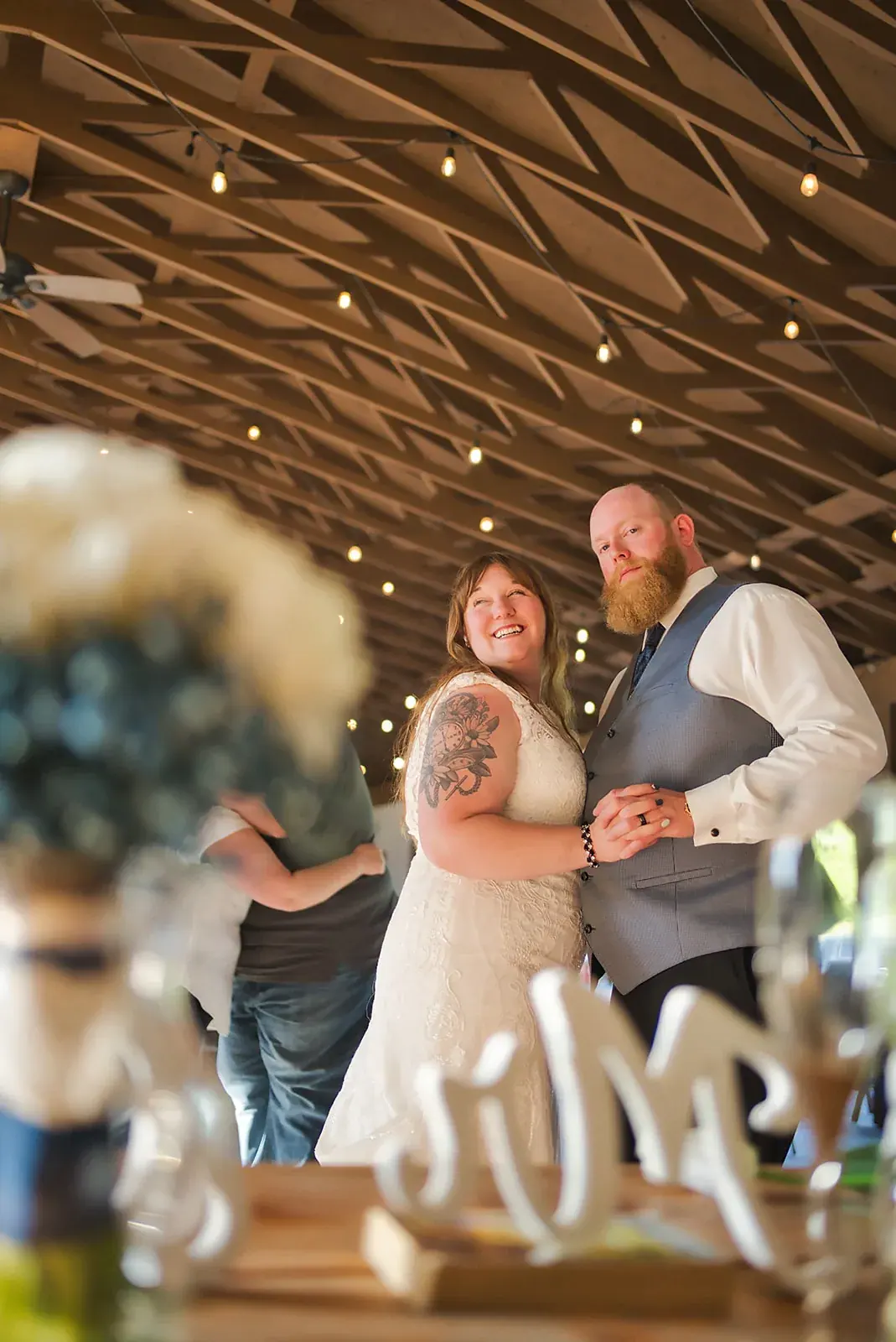 Reception pavilion candid — Kayla & Robert's wedding at Mackinaw Trail Winery, Petoskey