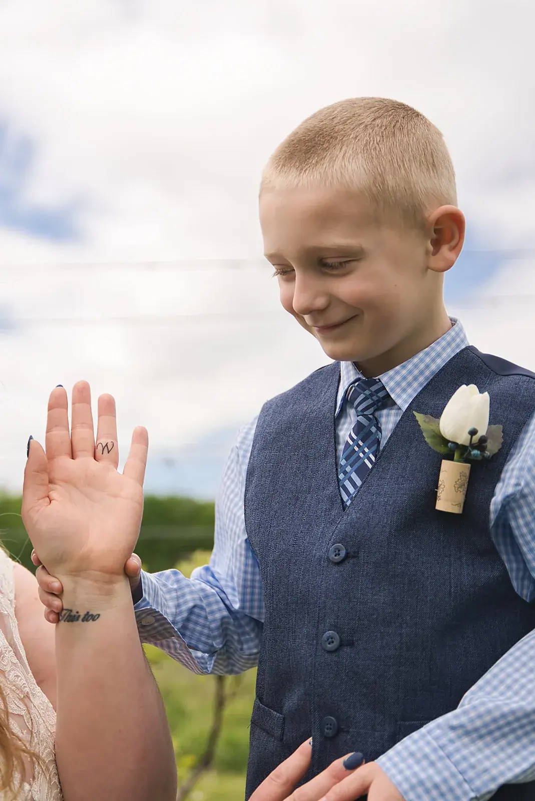 Ring bearer high five — Kayla & Robert's wedding at Mackinaw Trail Winery, Petoskey
