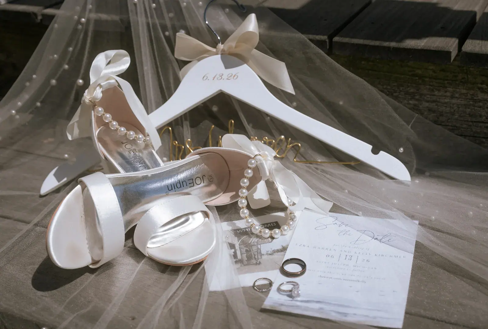 Bridal shoes rings flatlay — Kelly & Ezra's wedding at Aria at The Whitcomb, St. Joseph