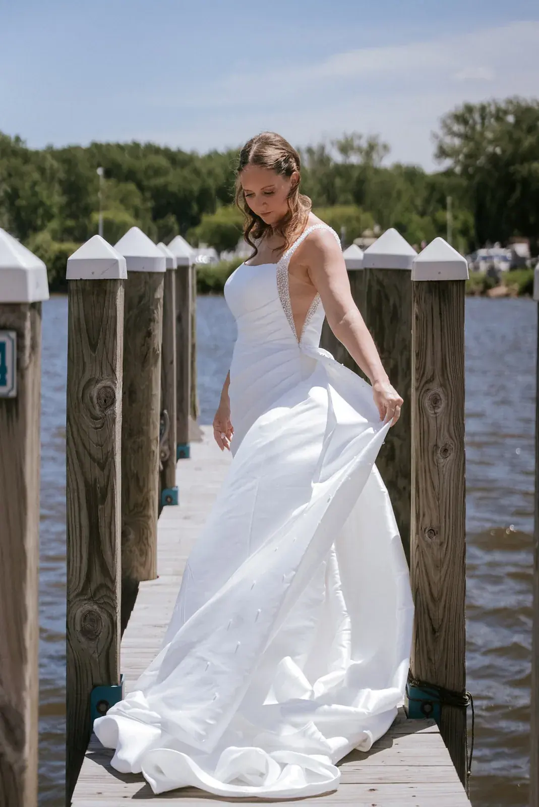 Bride dock portrait — Kelly & Ezra's wedding at Aria at The Whitcomb, St. Joseph