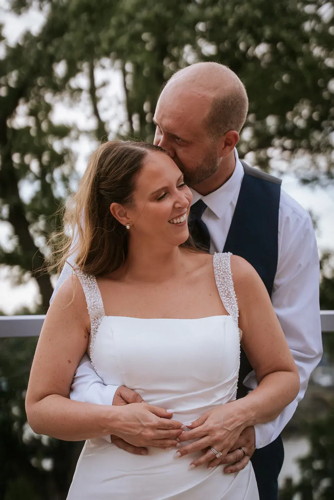 Bride and groom embrace close — Kelly & Ezra's wedding at Aria at The Whitcomb, St. Joseph
