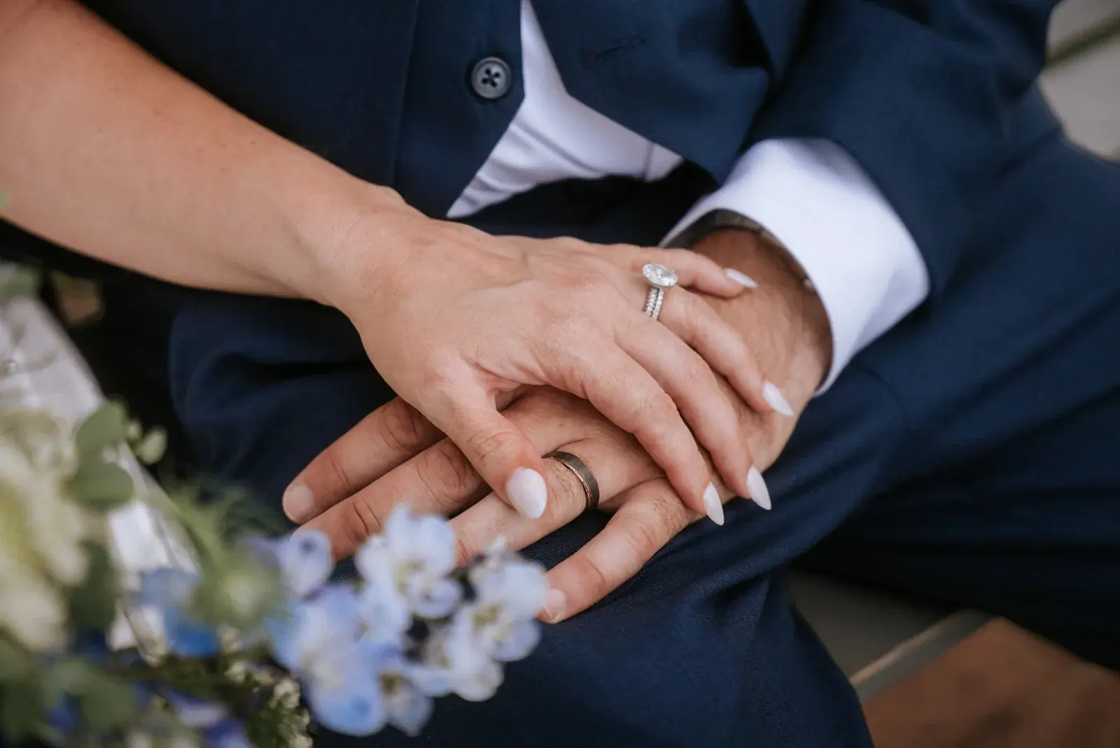 Bride and groom hands rings bouquet — Kelly & Ezra's wedding at Aria at The Whitcomb, St. Joseph