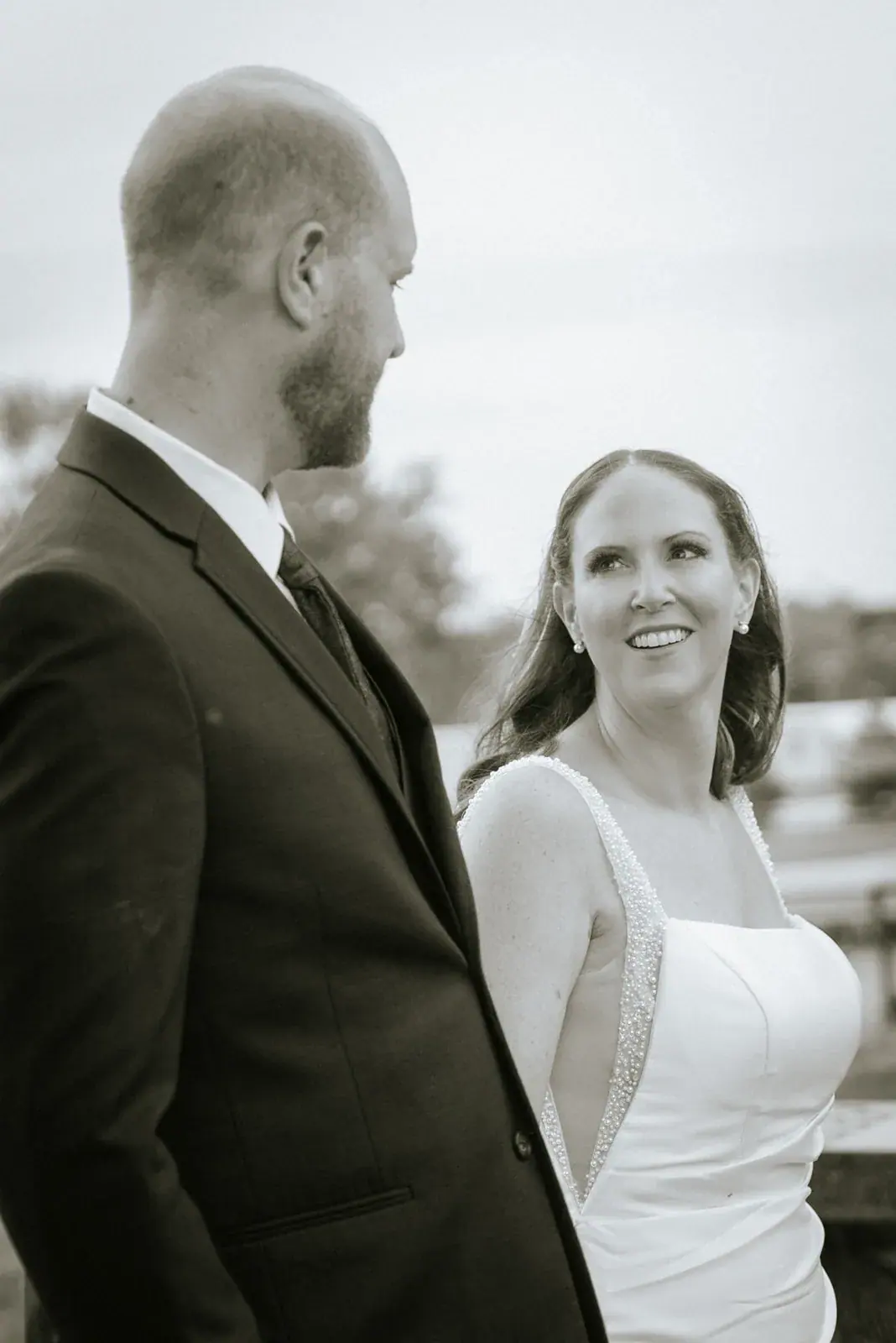 Bride and groom smiling in black and white — Kelly & Ezra's wedding at Aria at The Whitcomb, St. Joseph
