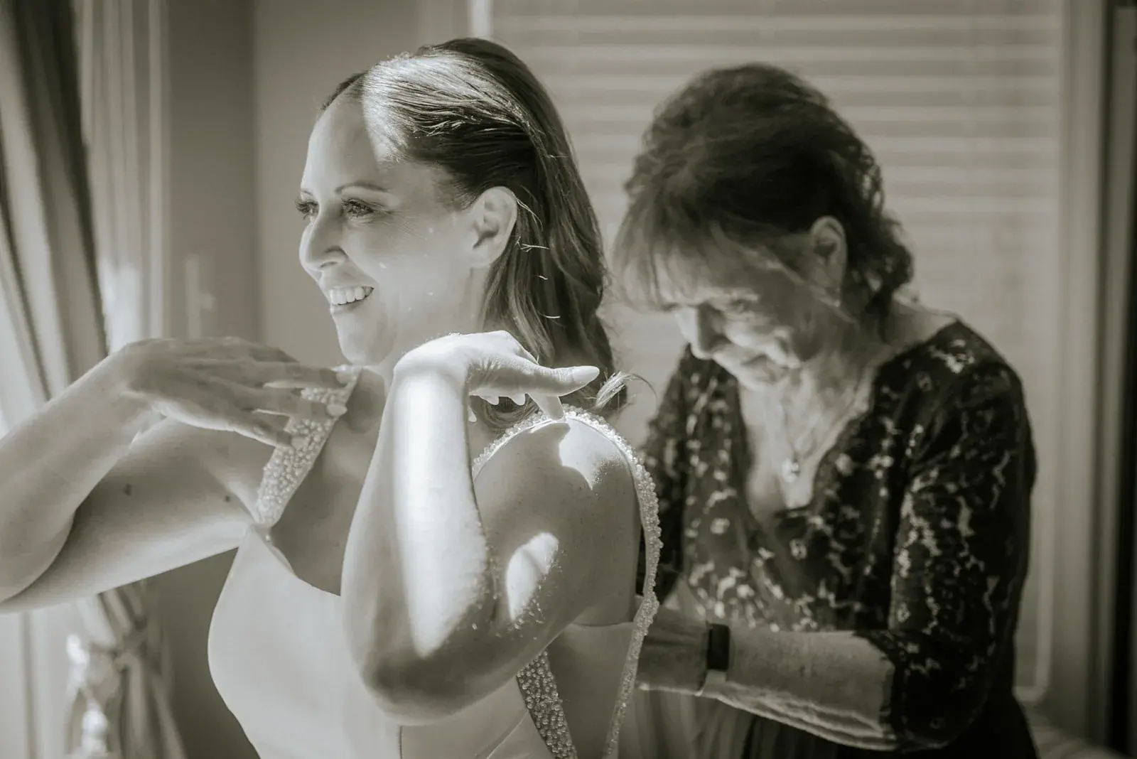 Bride mother candid in black and white — Kelly & Ezra's wedding at Aria at The Whitcomb, St. Joseph