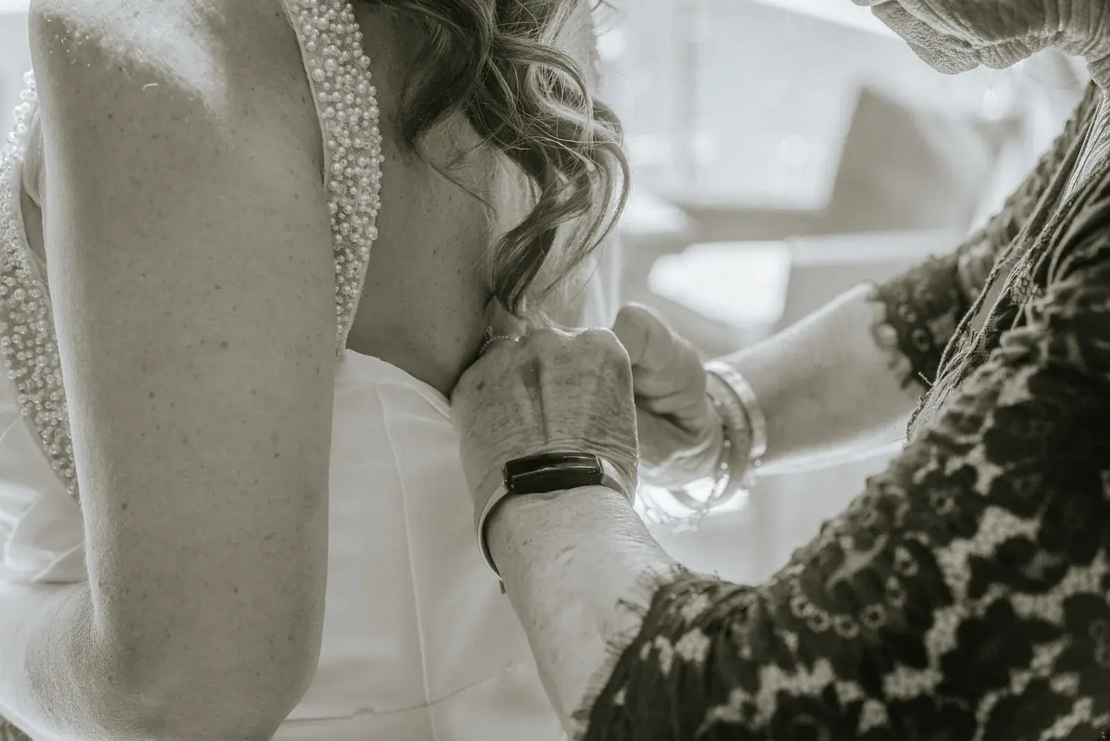 Bride mother hands detail — Kelly & Ezra's wedding at Aria at The Whitcomb, St. Joseph