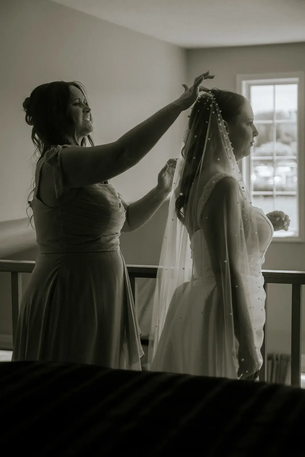 Bridesmaid placing veil — Kelly & Ezra's wedding at Aria at The Whitcomb, St. Joseph