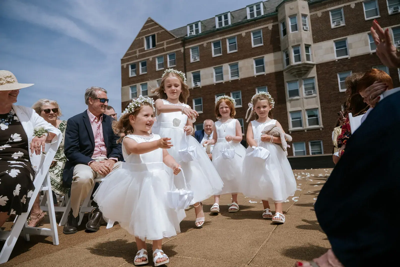 Flower girls walking aisle — Kelly & Ezra's wedding at Aria at The Whitcomb, St. Joseph