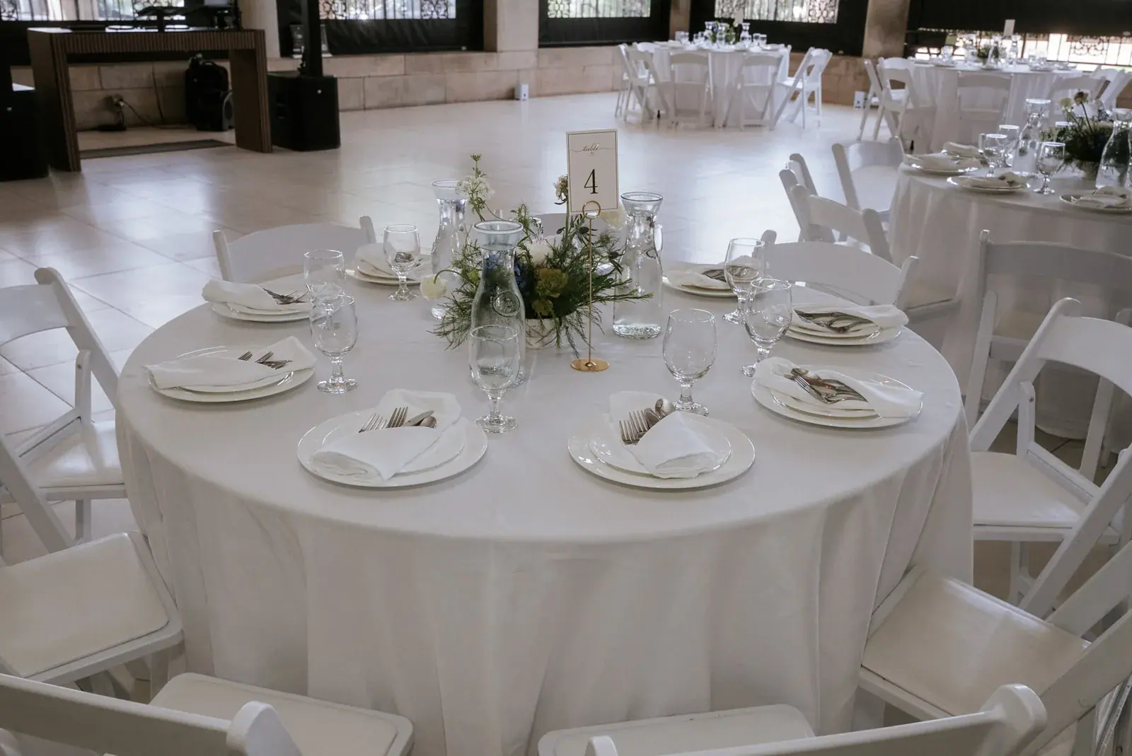 Reception table setting — Kelly & Ezra's wedding at Aria at The Whitcomb, St. Joseph