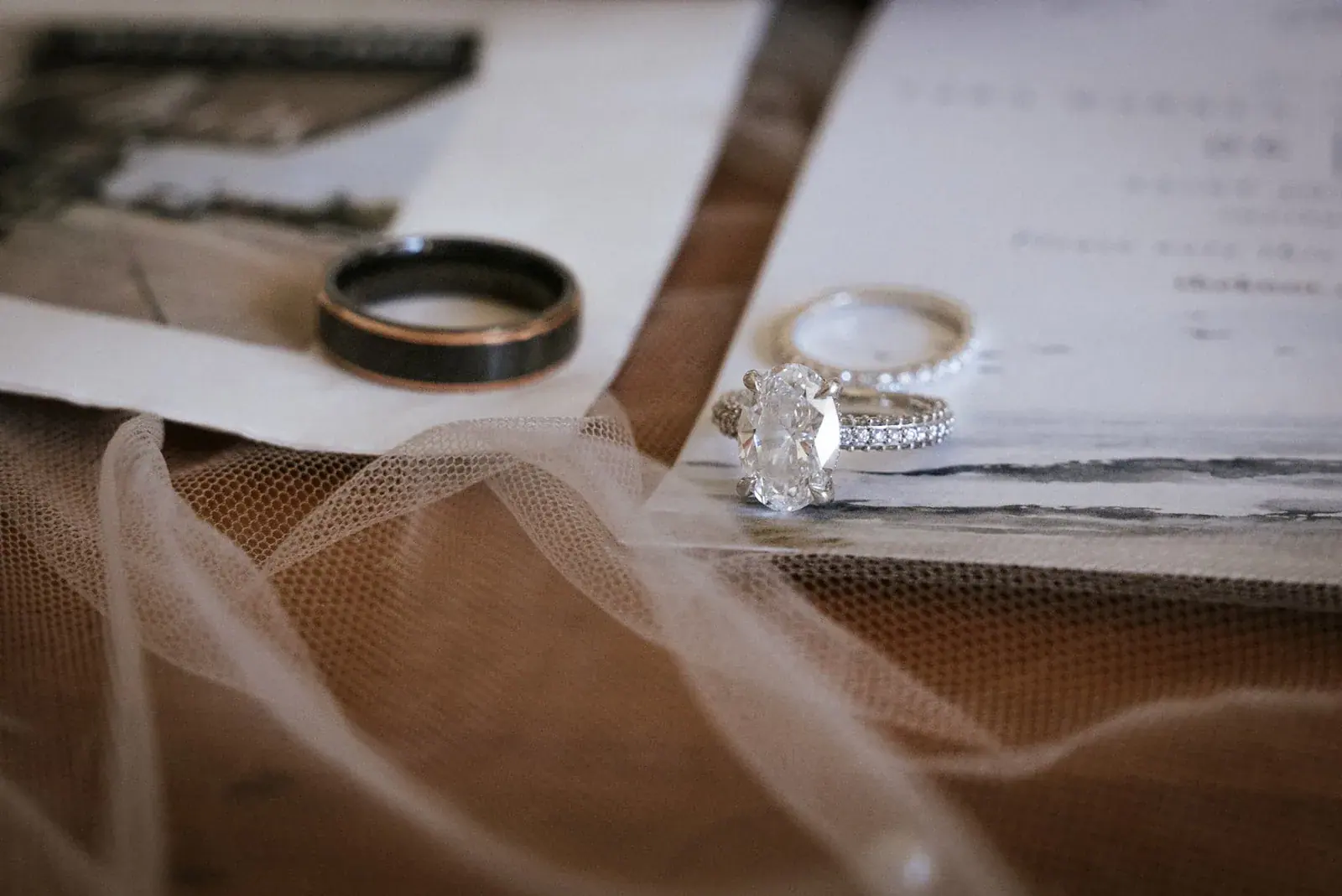 Wedding rings letter detail — Kelly & Ezra's wedding at Aria at The Whitcomb, St. Joseph