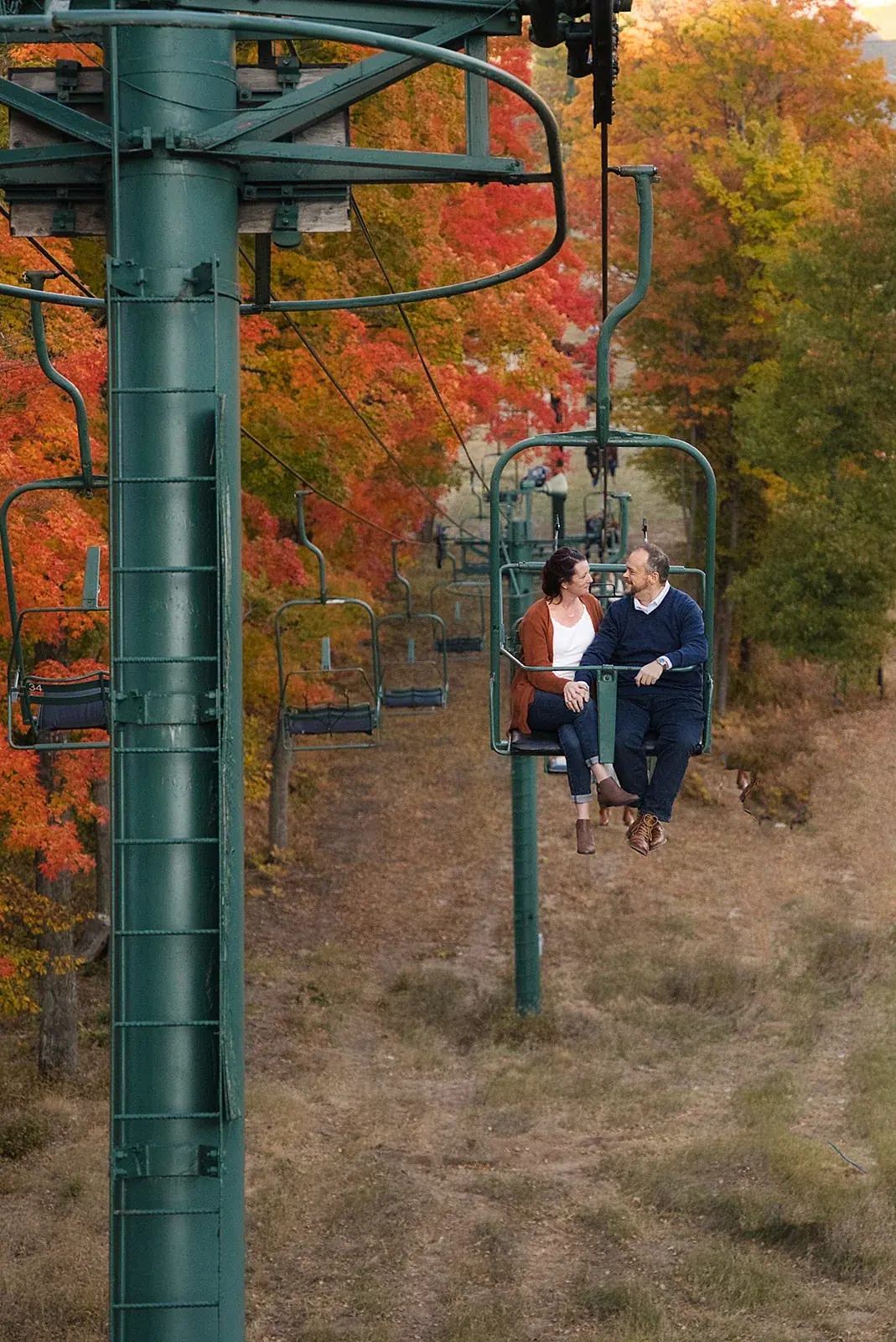 Chairlift fall colors — Matt & Adrian's engagement session at Boyne Mountain Resort