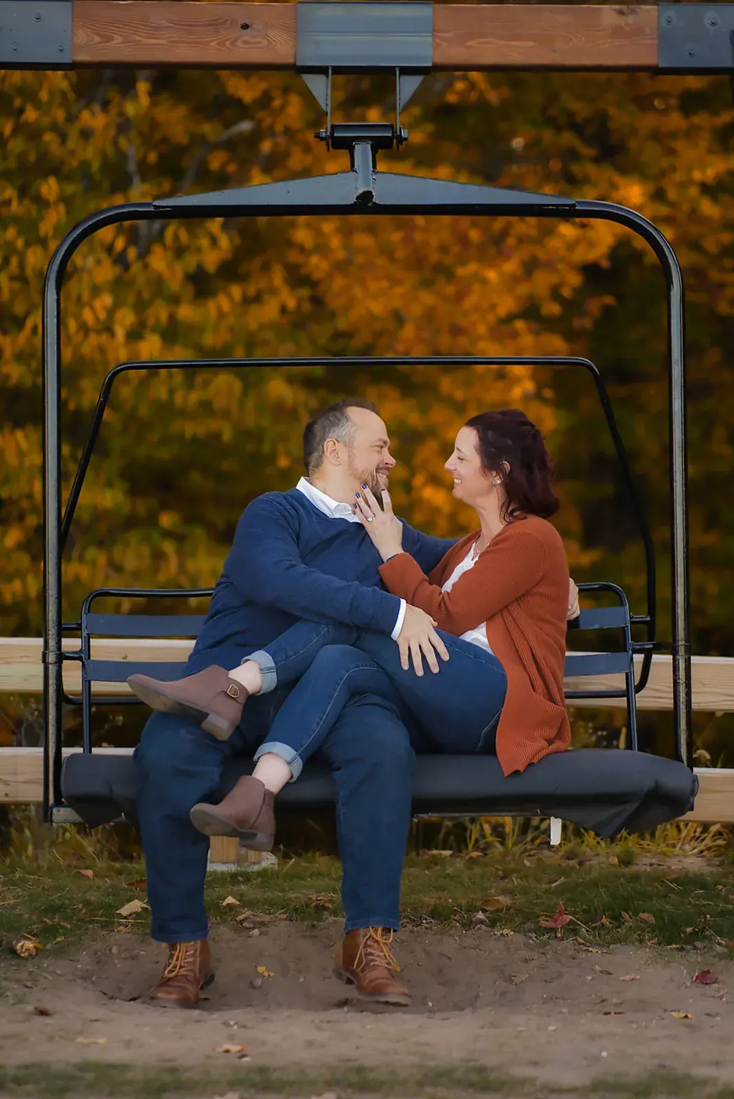 Chairlift seat fall portrait — Matt & Adrian's engagement session at Boyne Mountain Resort