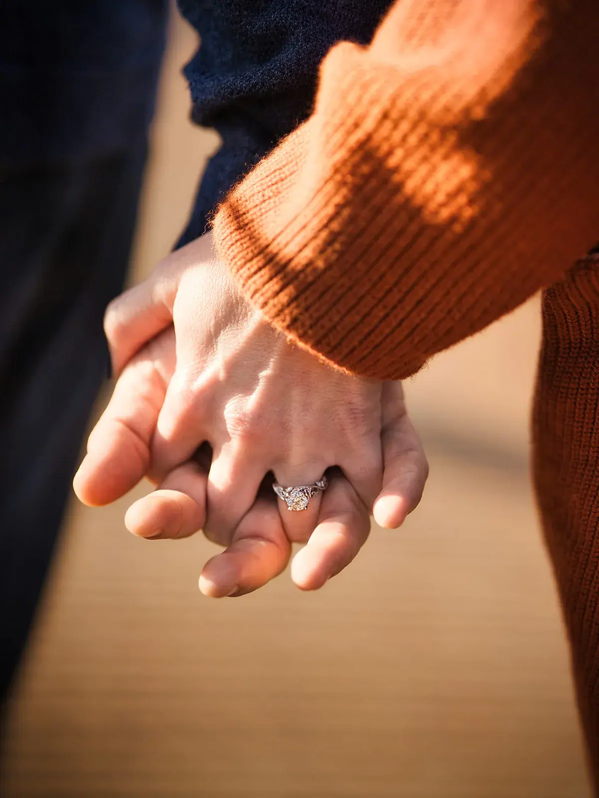 Holding hands engagement ring — Matt & Adrian's engagement session at Boyne Mountain Resort
