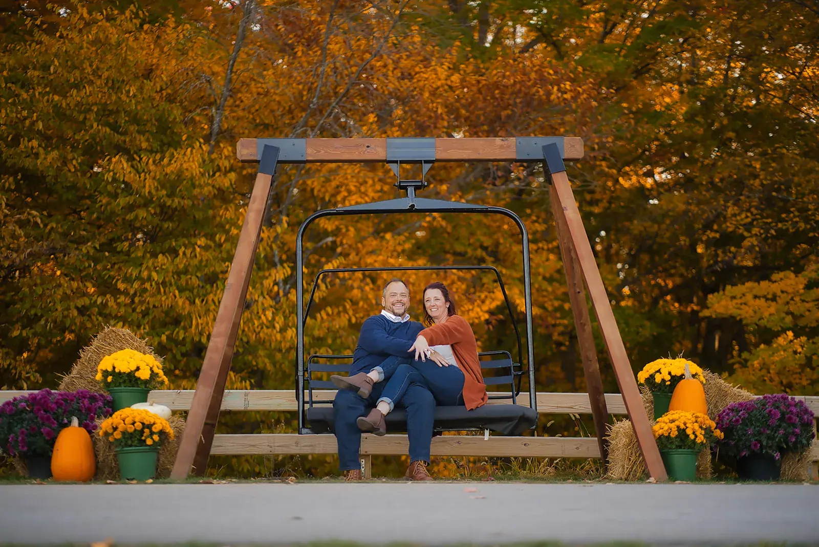 Porch swing fall mums — Matt & Adrian's engagement session at Boyne Mountain Resort
