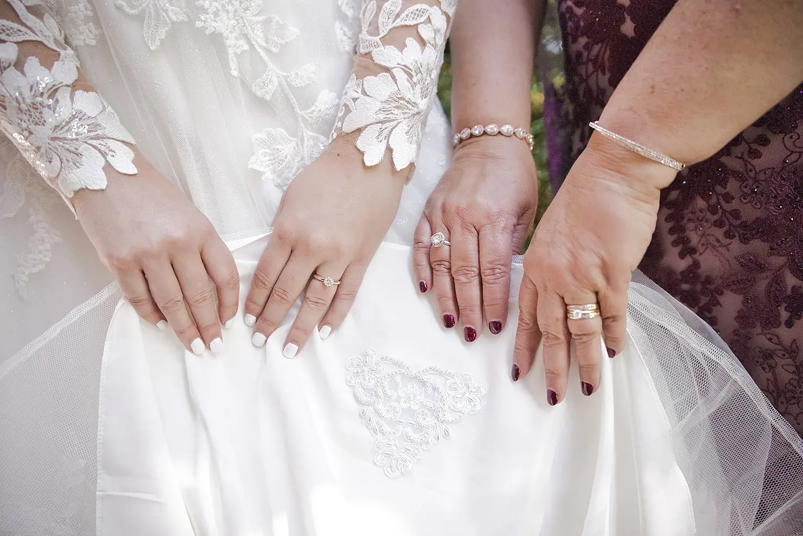 Bride bridesmaid hands detail — Megan & AJ's wedding at The Manor at Fire Tower Hill, Lewiston