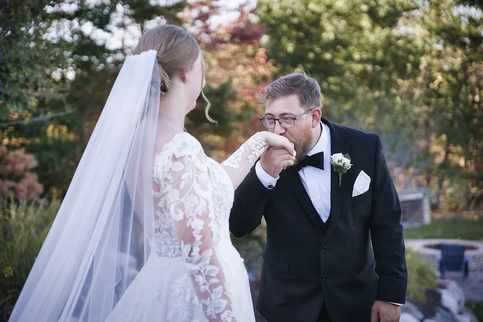 Bride kissing groom hand — Megan & AJ's wedding at The Manor at Fire Tower Hill, Lewiston