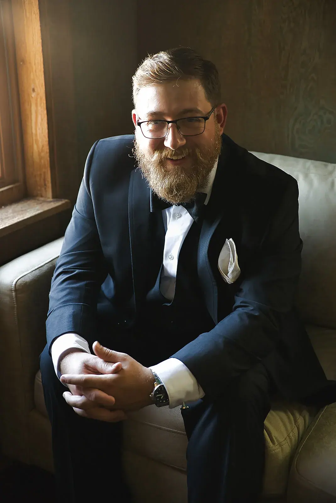 Groom portrait chair — Megan & AJ's wedding at The Manor at Fire Tower Hill, Lewiston