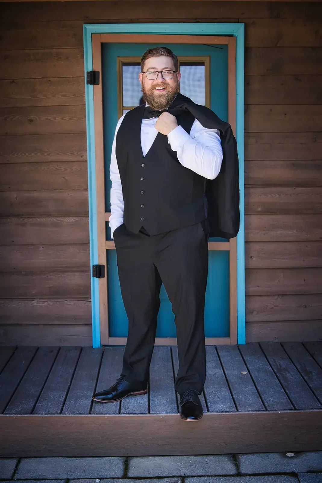 Groom portrait teal door — Megan & AJ's wedding at The Manor at Fire Tower Hill, Lewiston
