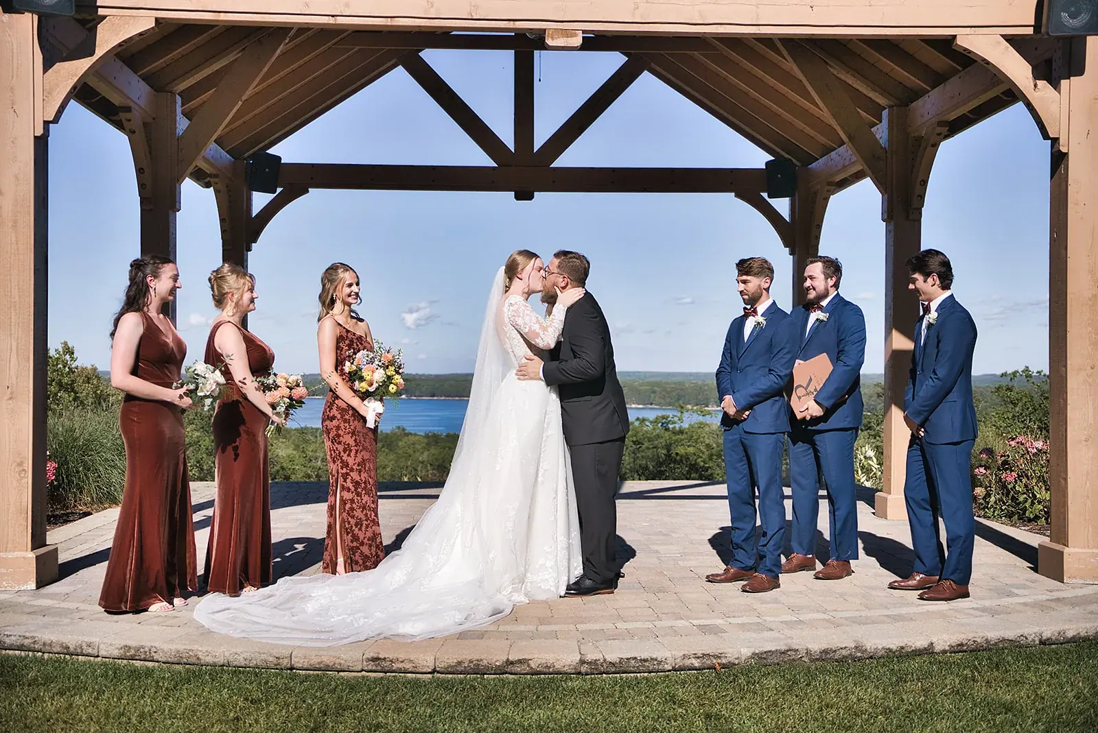 Pavilion ceremony kiss lake — Megan & AJ's wedding at The Manor at Fire Tower Hill, Lewiston