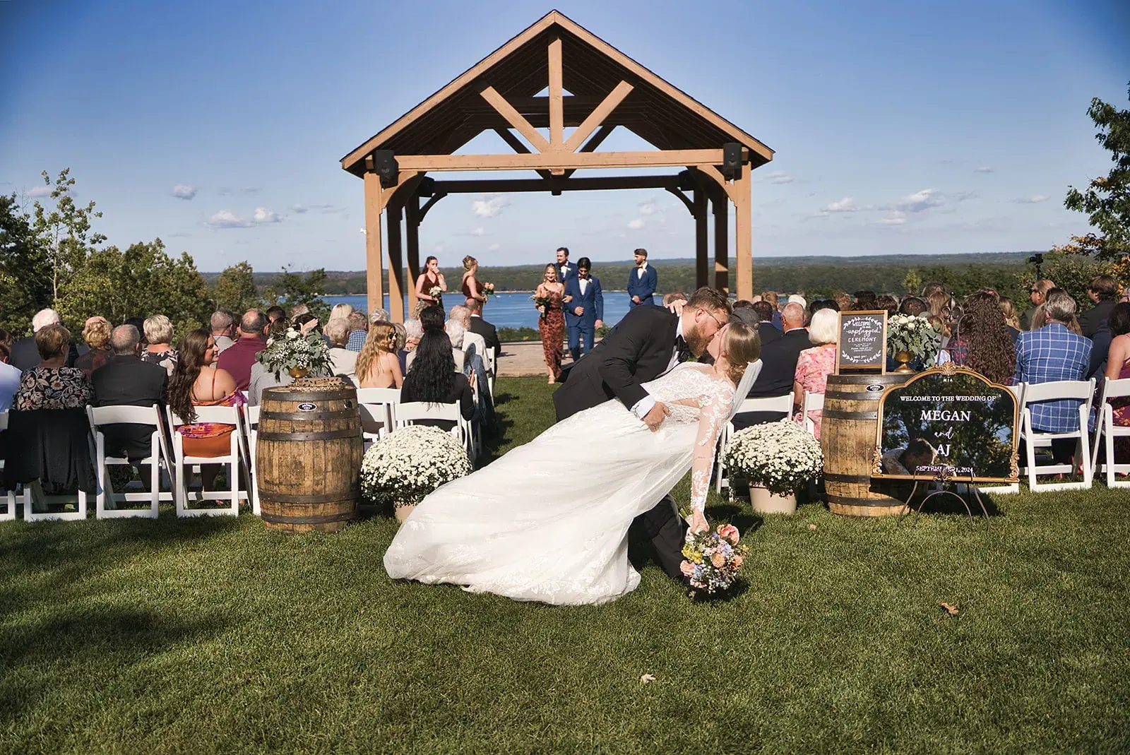 Pavilion ceremony lake view dip — Megan & AJ's wedding at The Manor at Fire Tower Hill, Lewiston