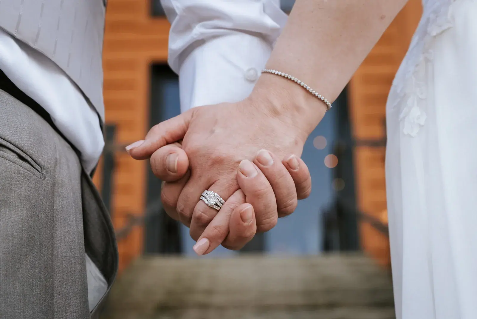 Holding hands ring detail — Patty & Nick's wedding at The Manor at Fire Tower Hill, Lewiston