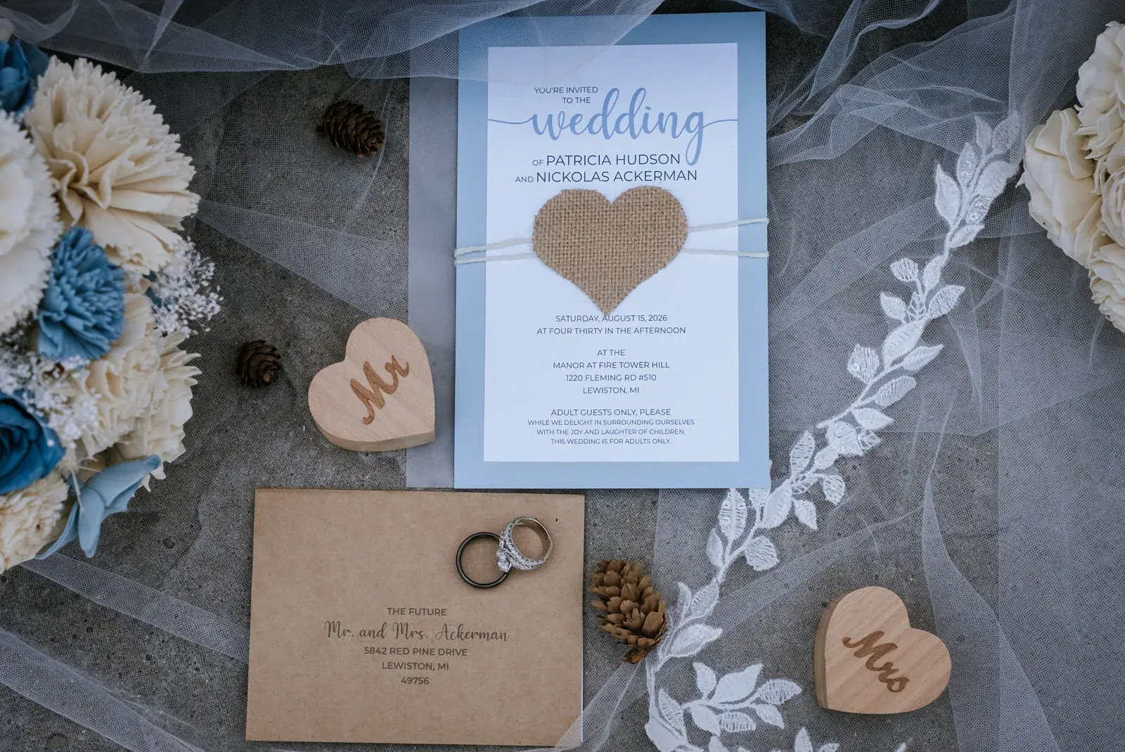 Invitation flatlay detail — Patty & Nick's wedding at The Manor at Fire Tower Hill, Lewiston