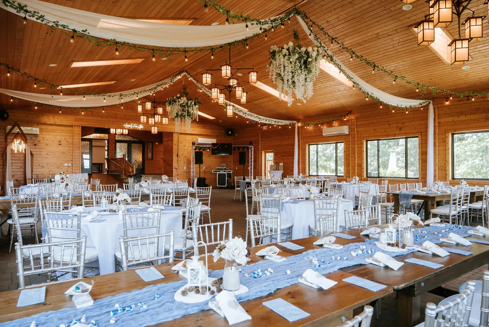 Lodge reception hall string lights — Patty & Nick's wedding at The Manor at Fire Tower Hill, Lewiston