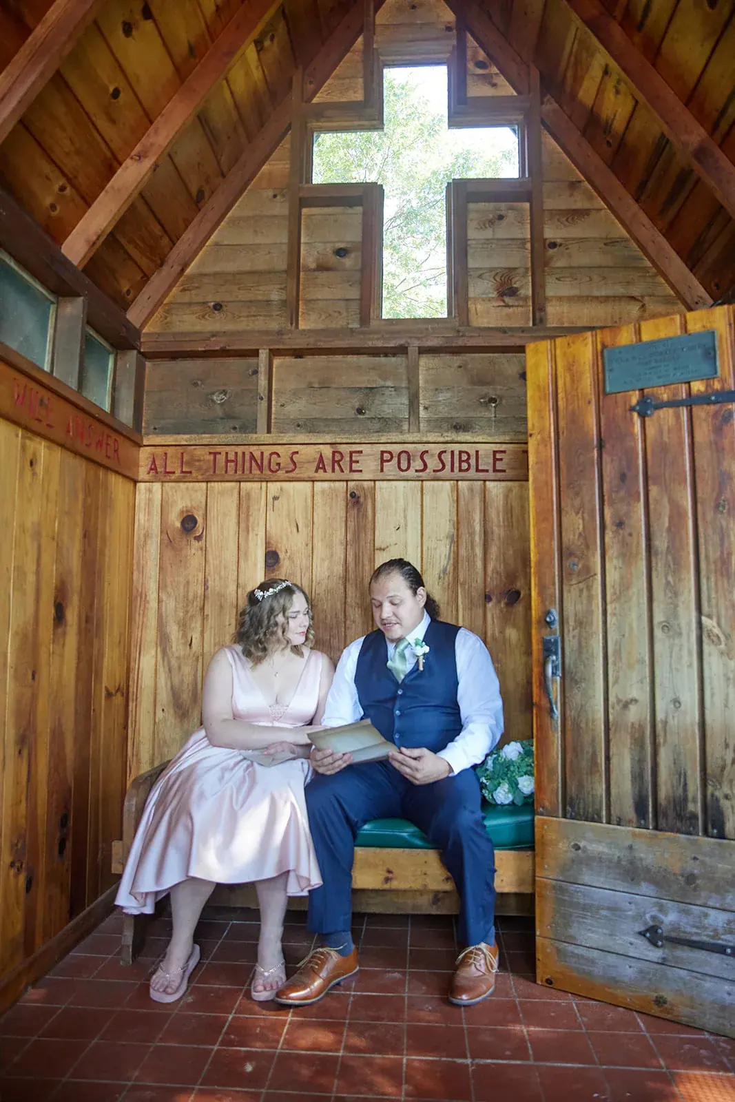Bride and groom chapel bench — Rachel & Alberto's wedding at Higher Ground at Lake Louise, Boyne Falls
