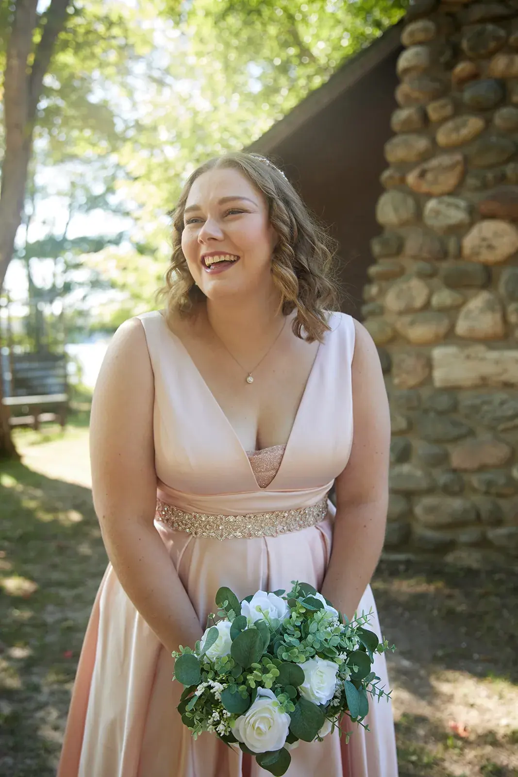 Bride smiling bouquet — Rachel & Alberto's wedding at Higher Ground at Lake Louise, Boyne Falls