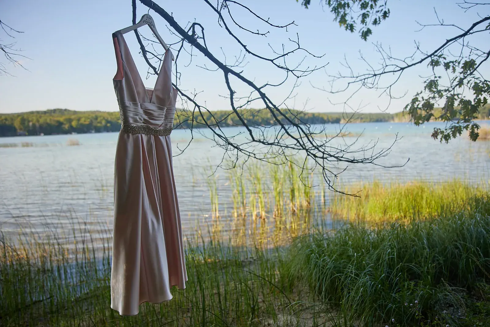 Wedding dress hanging lakeside — Rachel & Alberto's wedding at Higher Ground at Lake Louise, Boyne Falls